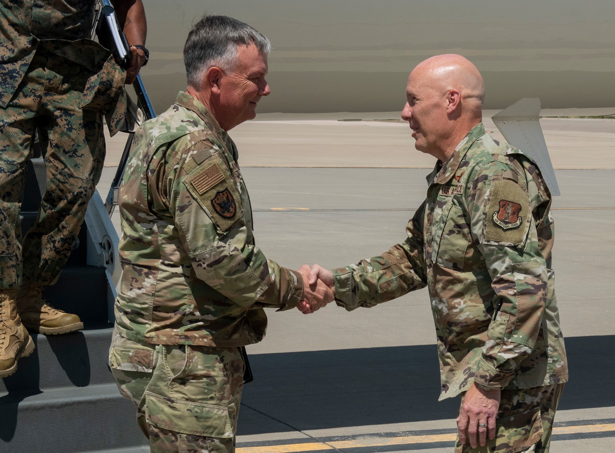 Gen. Glen VanHerck, left, Commander, North American Aerospace Defense Command and U.S. Northern Command, is welcomed to Holloman Air Force Base by Brig. Gen. Daniel Gabrielli, Task Force - Holloman commander, Sept. 7, 2021.  Gen. VanHerck was joined by Sgt. Maj. James Porterfield, Command Senior Enlisted Leader, NORAD and USNRTHCOM; Mr. Terry Todd, Department of Homeland Security's Federal Coordinator at Holloman AFB; Mr. Joe Parente, Department of State Team Lead; Rep. Melanie Stansbury (D-NM-1) and Rep. Yvette Herrell (R-NM-2), in touring housing facilities and other support functions for the Afghan evacuees on the installation. (U.S. Air Force photo by Staff Sgt. Kenneth Boyton)