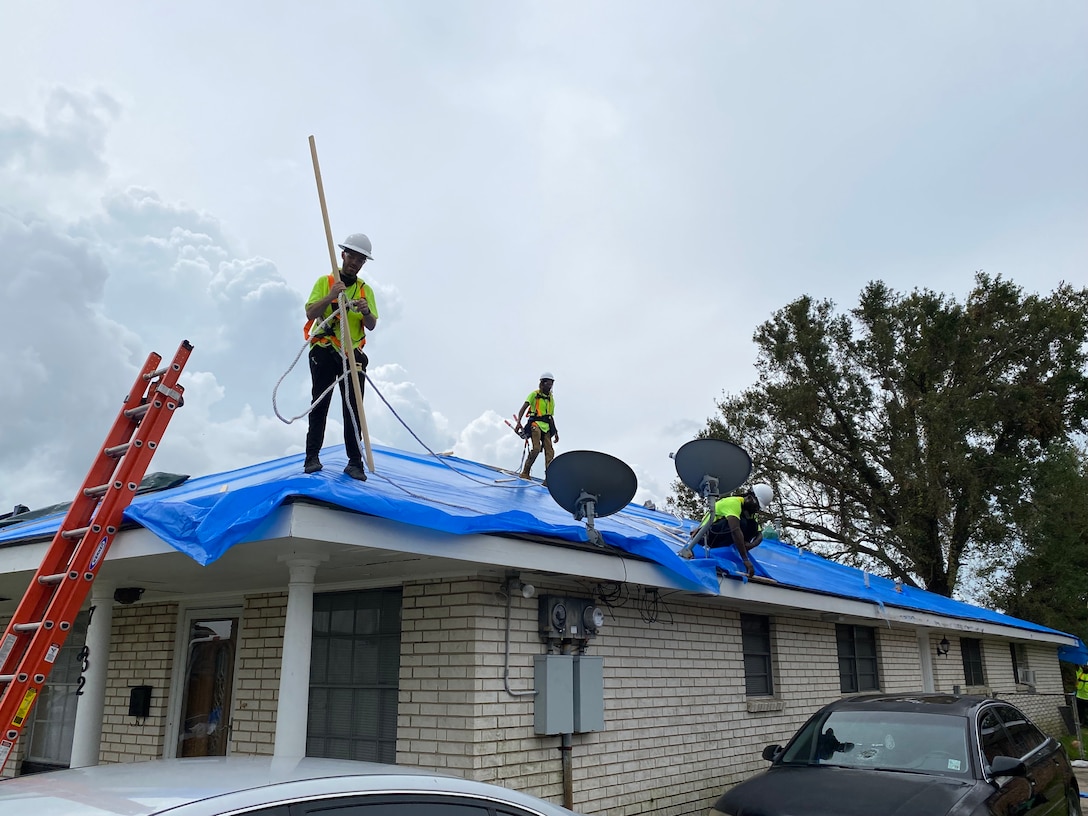USACE contractors in New Orleans install reinforced plastic sheeting today for the first home to benefit from Operation Blue Roof since Hurricane Ida.