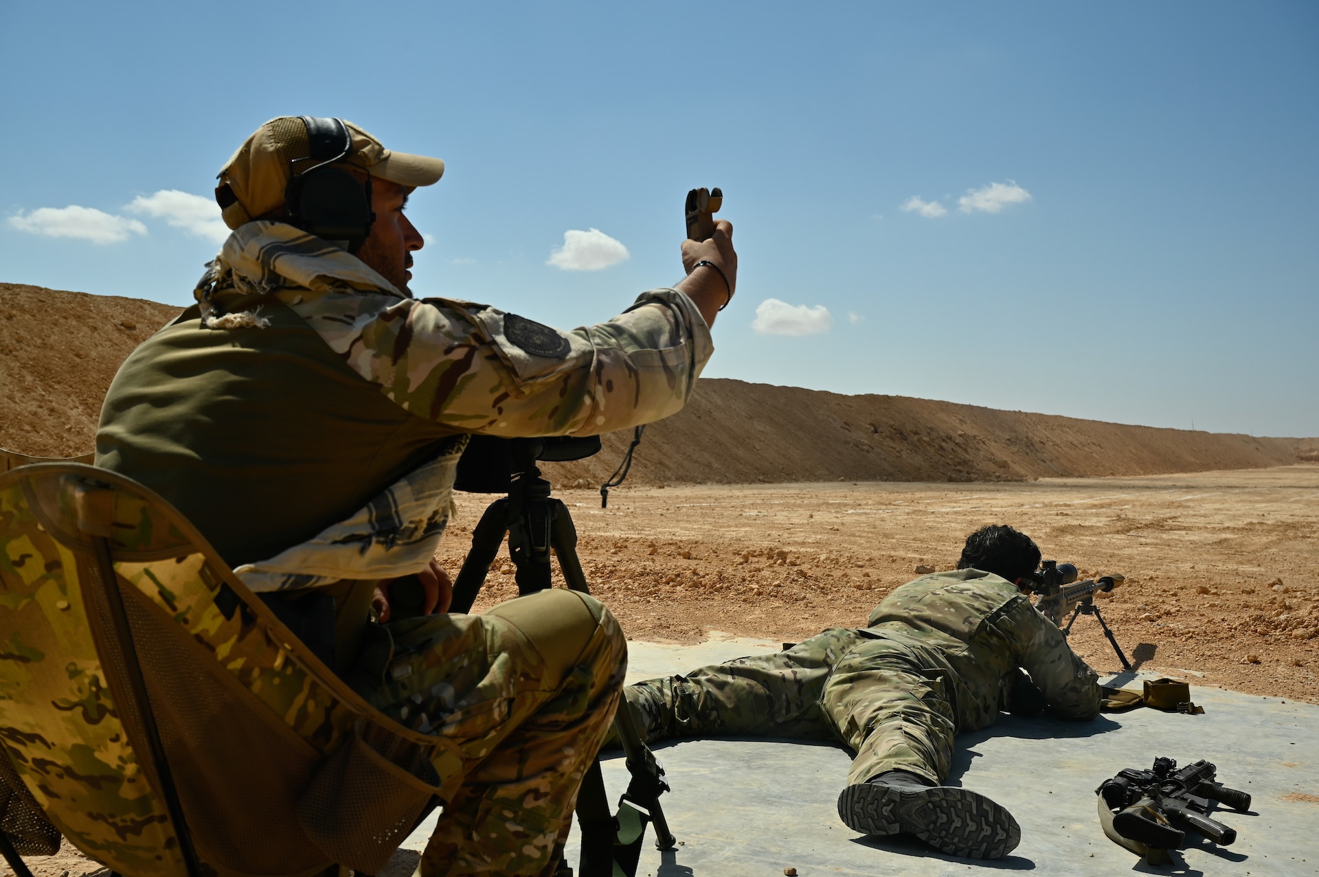 U.S. and partner nation special operations forces work together to improve firing techniques during Bright Star 21 (BS21) at Mohamed Naguib Military Base (MNMB), Egypt, Sept. 5, 2021. BS21 increases interoperability for future threat response in conventional and irregular warfare. (U.S. Army photo by Spc. Amber Cobena)