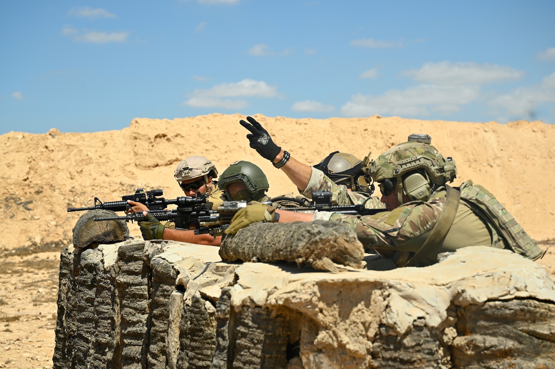 U.S. and partner nation special operations forces work together to improve firing techniques during Bright Star 21 (BS21) at Mohamed Naguib Military Base (MNMB), Egypt, Sept. 5, 2021. BS21 increases interoperability for future threat response in conventional and irregular warfare. (U.S. Army photo by Spc. Amber Cobena)