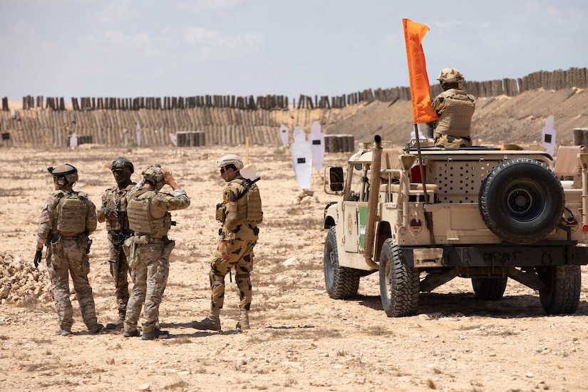 U.S., Jordanian, and Egyptian special operators work together to execute live fire battle drills during Bright Star 21 (BS21) at Mohamed Naguib Military Base (MNMB), Egypt, Sept. 5, 2021. BS21 increases interoperability for future threat response in conventional and irregular warfare. (U.S. Army photo by Spc. Amber Cobena)