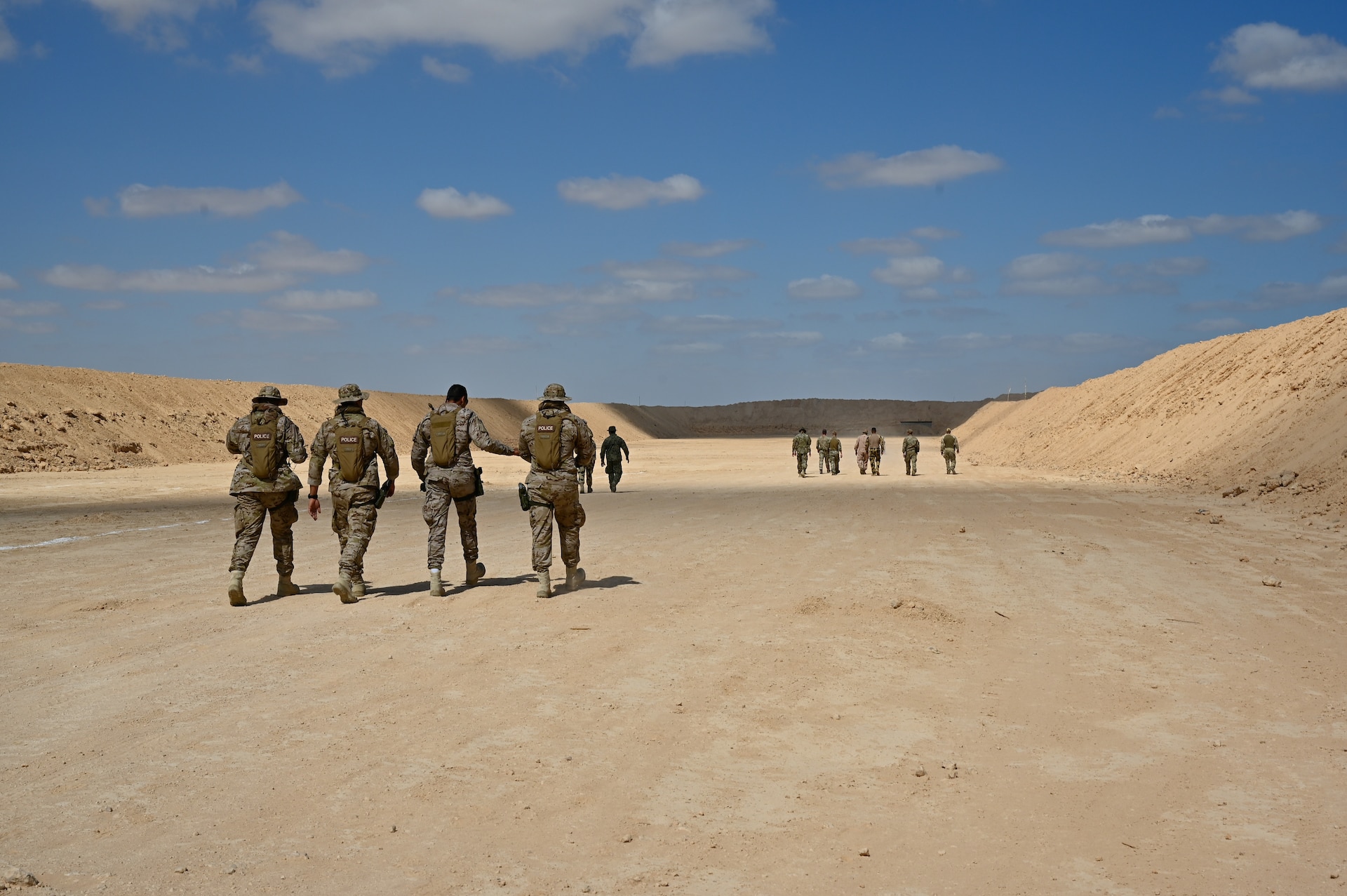 U.S., Egypt, Greece, Cyprus, Saudi Arabia and U.K special operations forces walk through the sniper range before live fire during Bright Star 21 (BS21) at Mohamed Naguib Military Base (MNMB), Egypt, Sept. 5, 2021. BS21 increases interoperability for future threat response in conventional and irregular warfare. (U.S. Army photo by Spc. Amber Cobena)