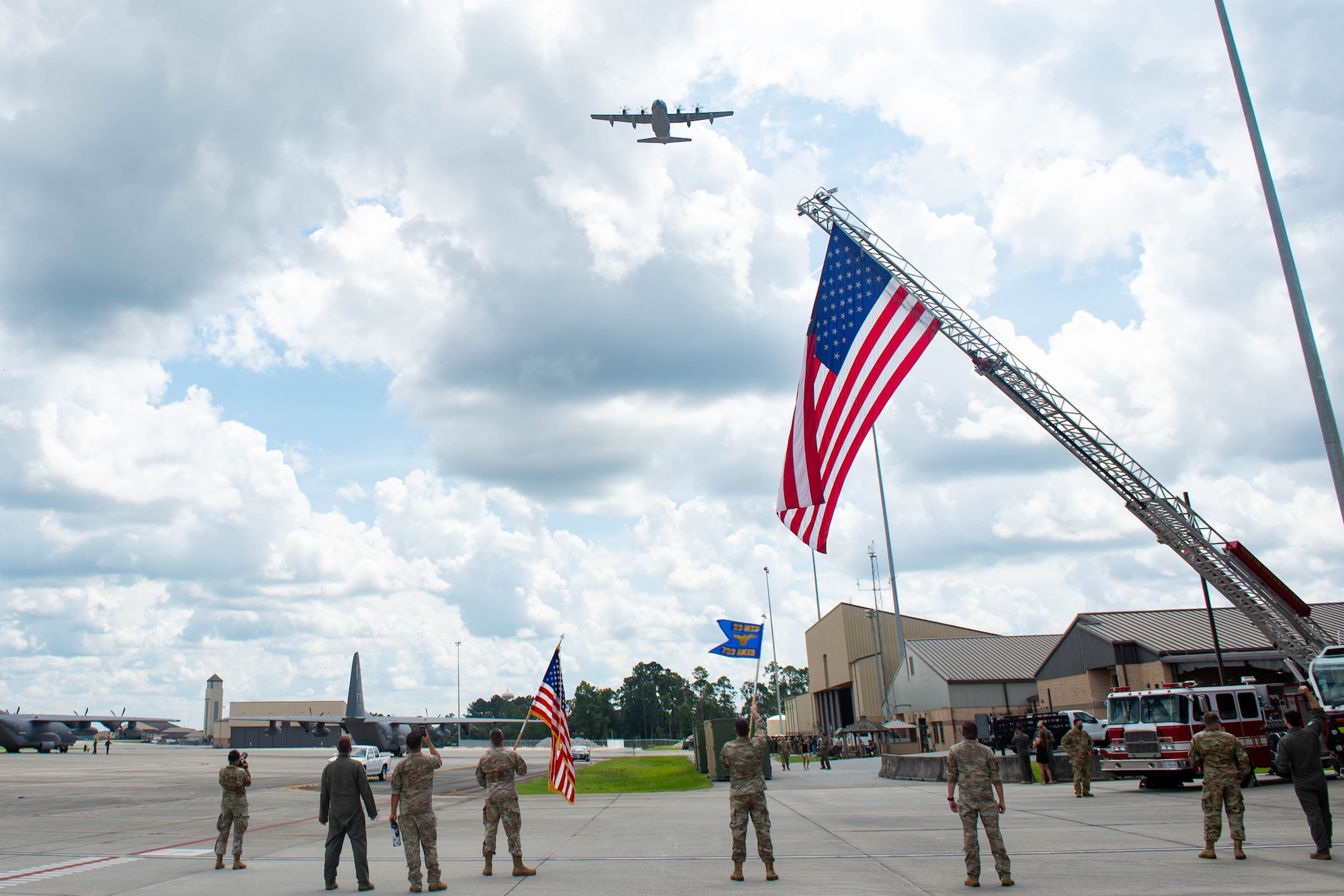 Photo of an aircraft flying over a military base