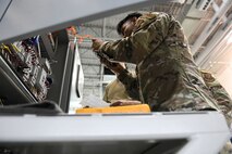Senior Airman Nishit Macwan, 741st Maintenance Squadron power, refrigeration and electrical laboratory technician, troubleshoots a missile alert facility chiller during the Global Strike Challenge July 26, 2021, at Malmstrom Air Force Base, Mont. PREL Airmen are specialists in electrical and refrigeration troubleshooting and repair. (U.S. Air Force photo by Airman Elijah Van Zandt)
