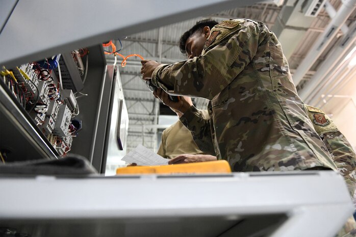 Senior Airman Nishit Macwan, 741st Maintenance Squadron power, refrigeration and electrical laboratory technician, troubleshoots a missile alert facility chiller during the Global Strike Challenge July 26, 2021, at Malmstrom Air Force Base, Mont. PREL Airmen are specialists in electrical and refrigeration troubleshooting and repair. (U.S. Air Force photo by Airman Elijah Van Zandt)