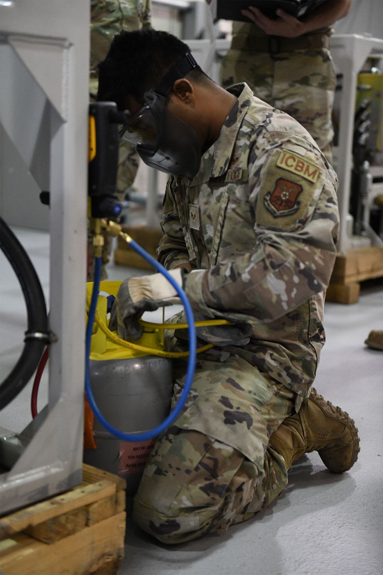 Senior Airman Nishit Macwan, 741st Maintenance Squadron power, refrigeration and electrical laboratory technician, troubleshoots a missile alert facility chiller during the Global Strike Challenge July 26, 2021, at Malmstrom Air Force Base, Mont. PREL Airmen are specialists in electrical and refrigeration troubleshooting and repair. (U.S. Air Force photo by Airman Elijah Van Zandt)