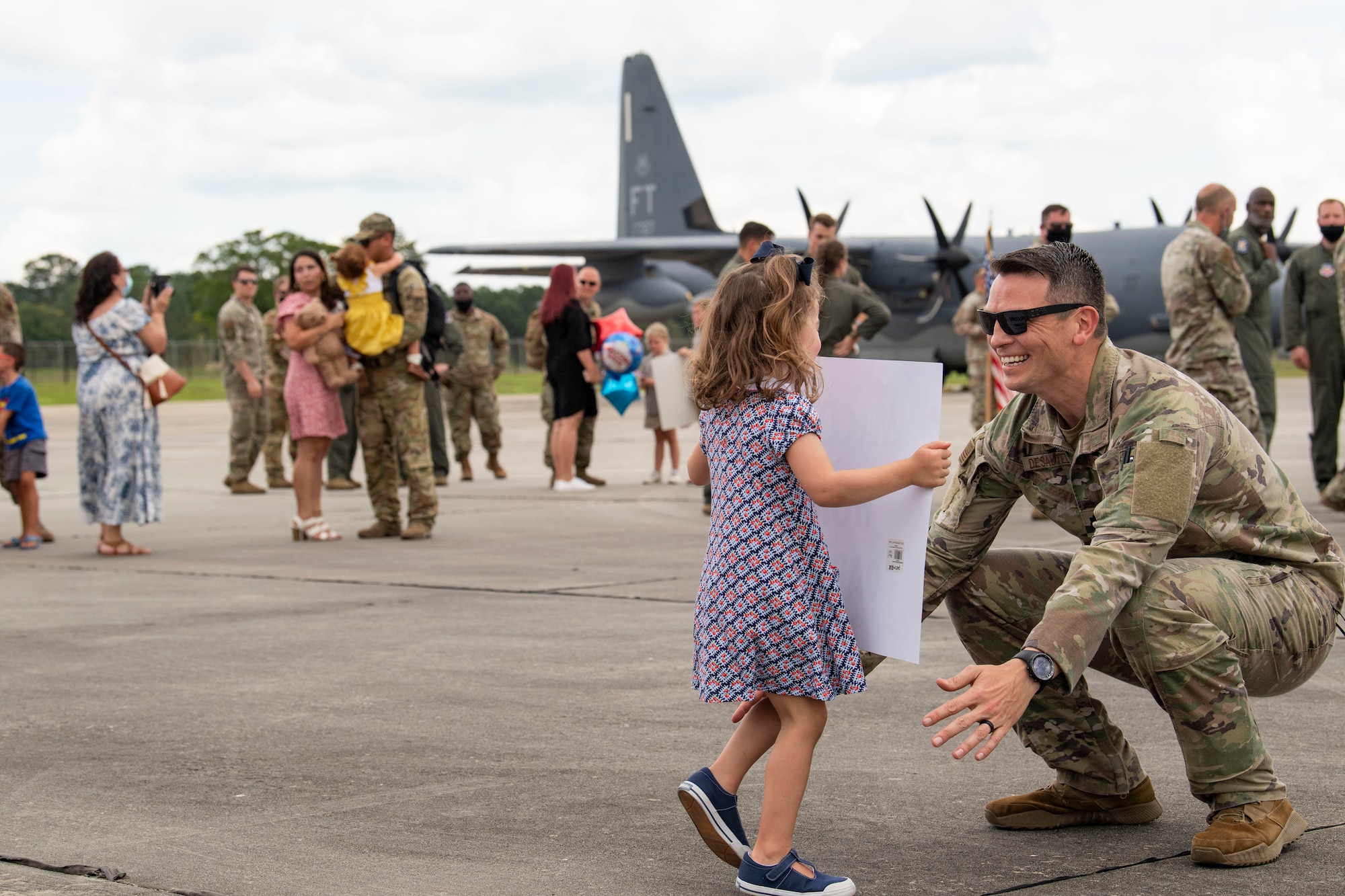 Photo of an Airman and his child