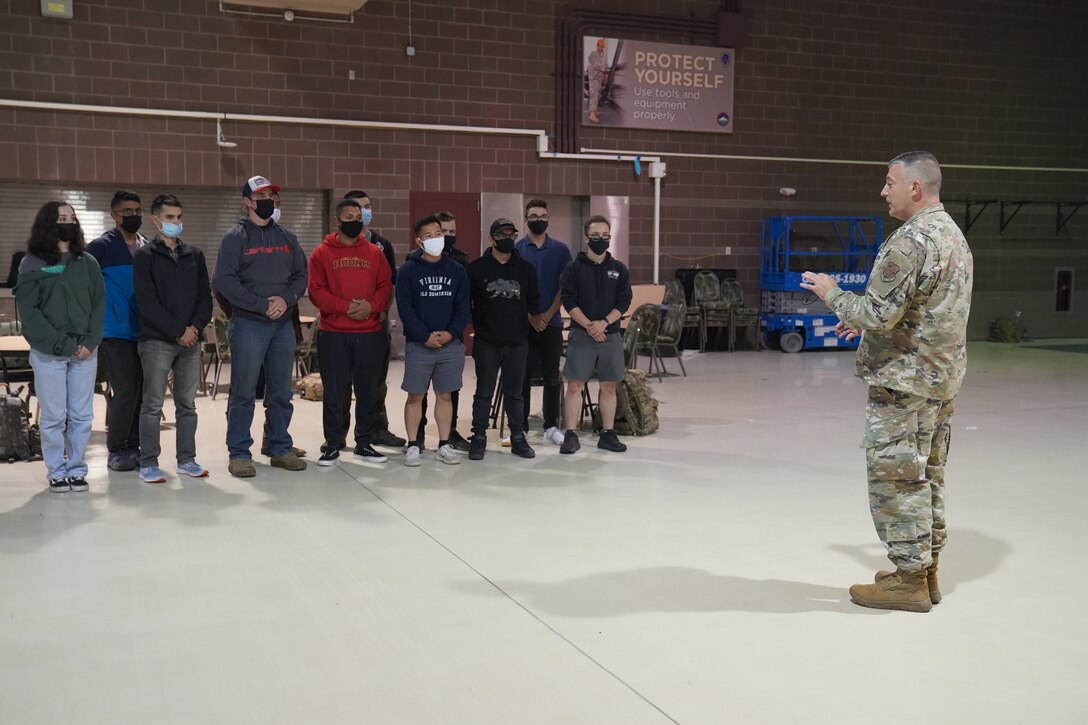 Maj. Gen. Torrence Saxe, adjutant general of the Alaska National Guard, speaks to Soldiers in the armory at Joint Base Elmendorf-Richardson, as they prepare to depart for Louisiana, Sept. 3, 2021. The 17 Army Guardsmen will assist the Louisiana National Guard’s support to civil authorities in the aftermath of Hurricane Ida, which struck the state, causing destruction and devastation, Aug. 29. The National Guard is the first military responder, assisting civil authorities and partner agencies with homeland security and response to state and national emergencies and disasters. The Soldiers are in civilian attire for travel on commercial aircraft. (Air National Guard photo by Lt. Col. Candis Olmstead)