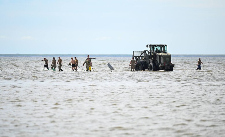 Airmen participate in water recovery operations.
