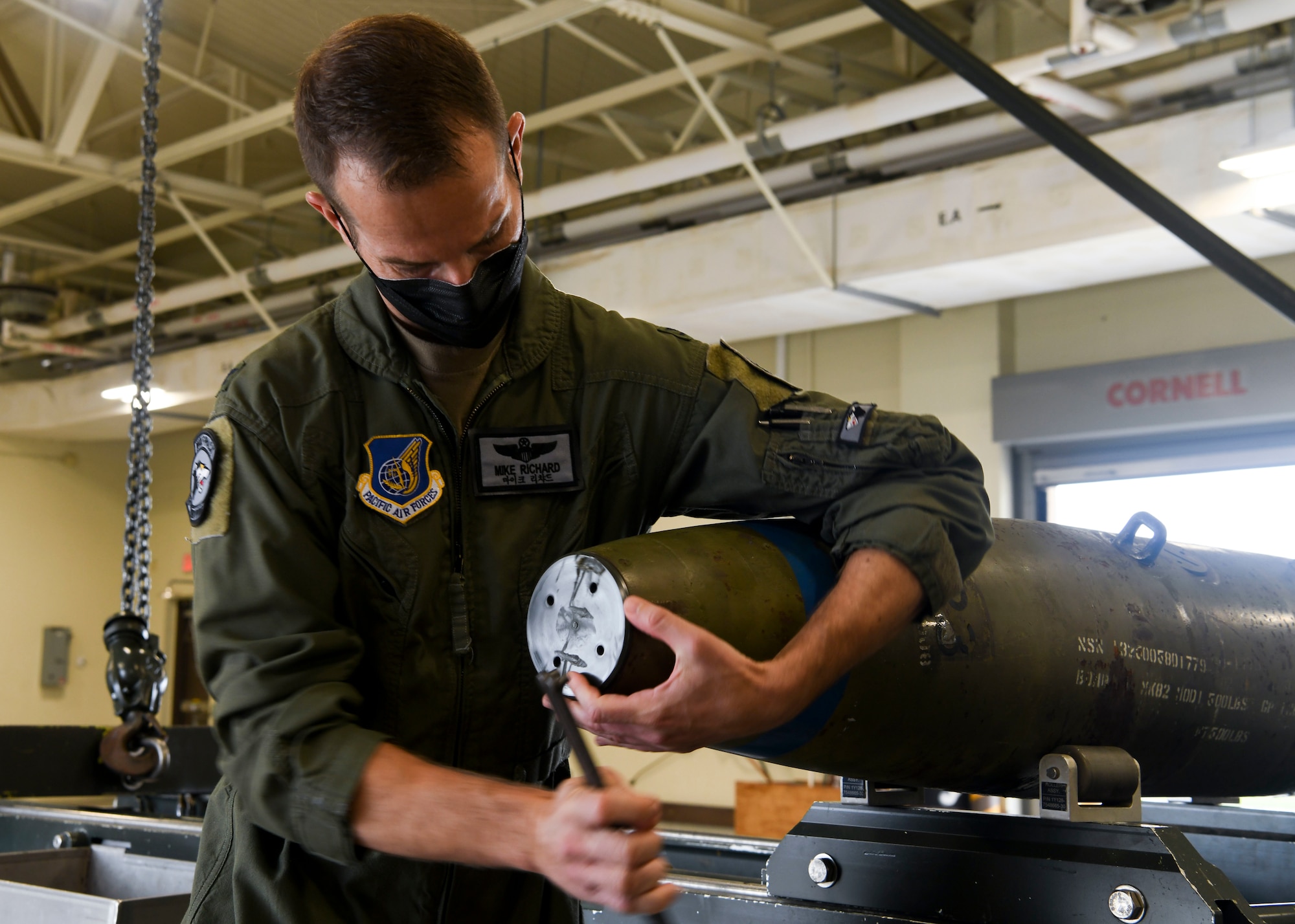 A commander works on a munition.