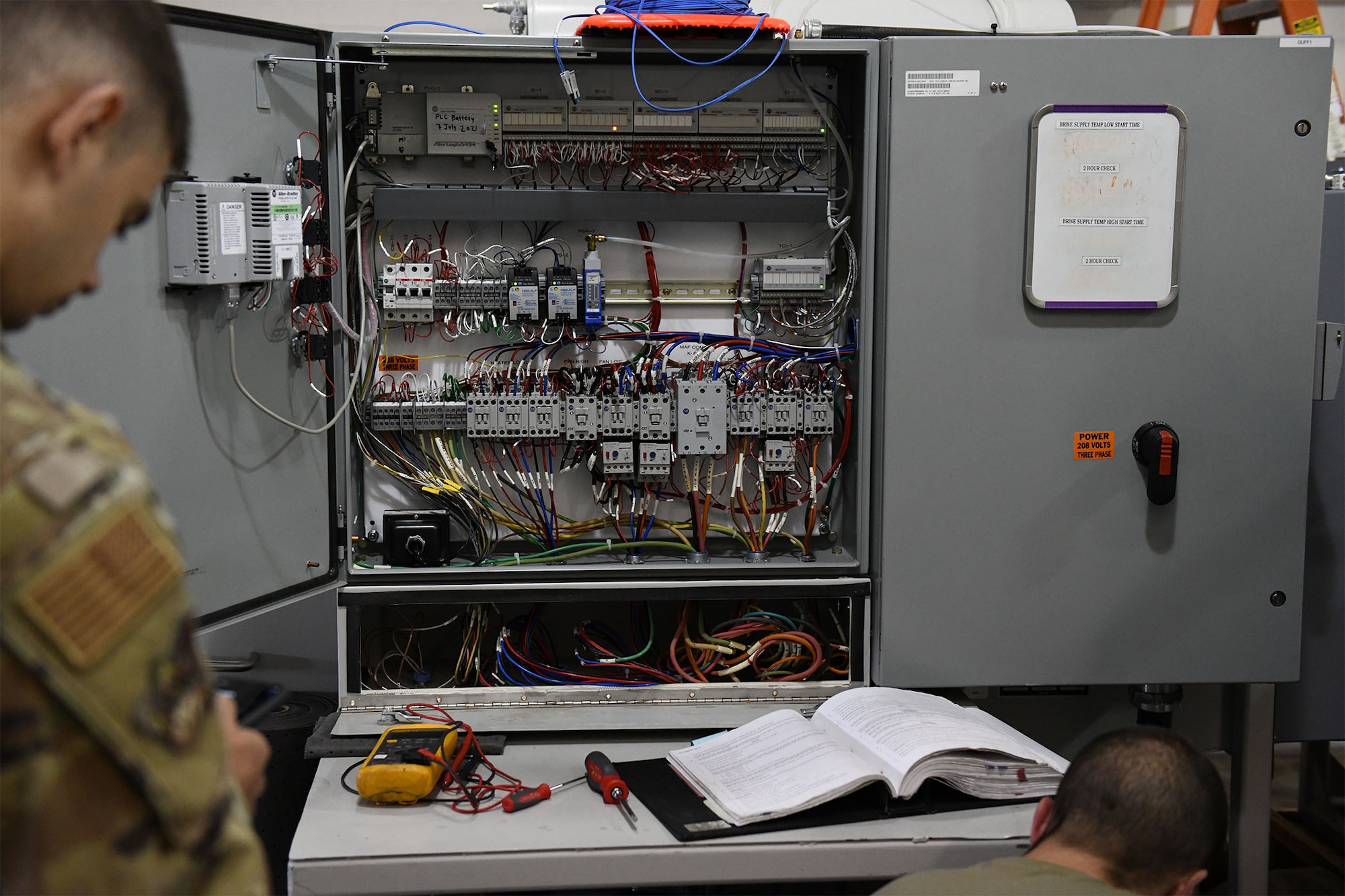 The electrical components of missile alert facility chiller are shown, which the power, refrigeration and electrical laboratory team participating in the 2021 Global Strike Challenge was tasked to repair July 26, 2021 at Malmstrom Air Force Base, Mont. PREL is a facilities maintenance career field, which is a branch of missile maintenance that specializes in electrical and refrigeration troubleshooting and repair. (U.S. Air Force photo by Airman Elijah Van Zandt)