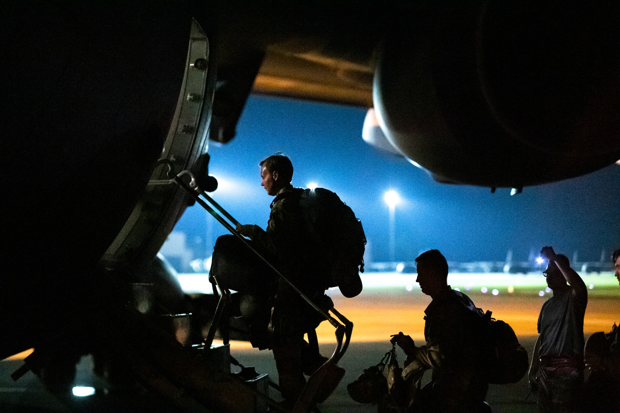 Photo of Airmen boarding an aircraft