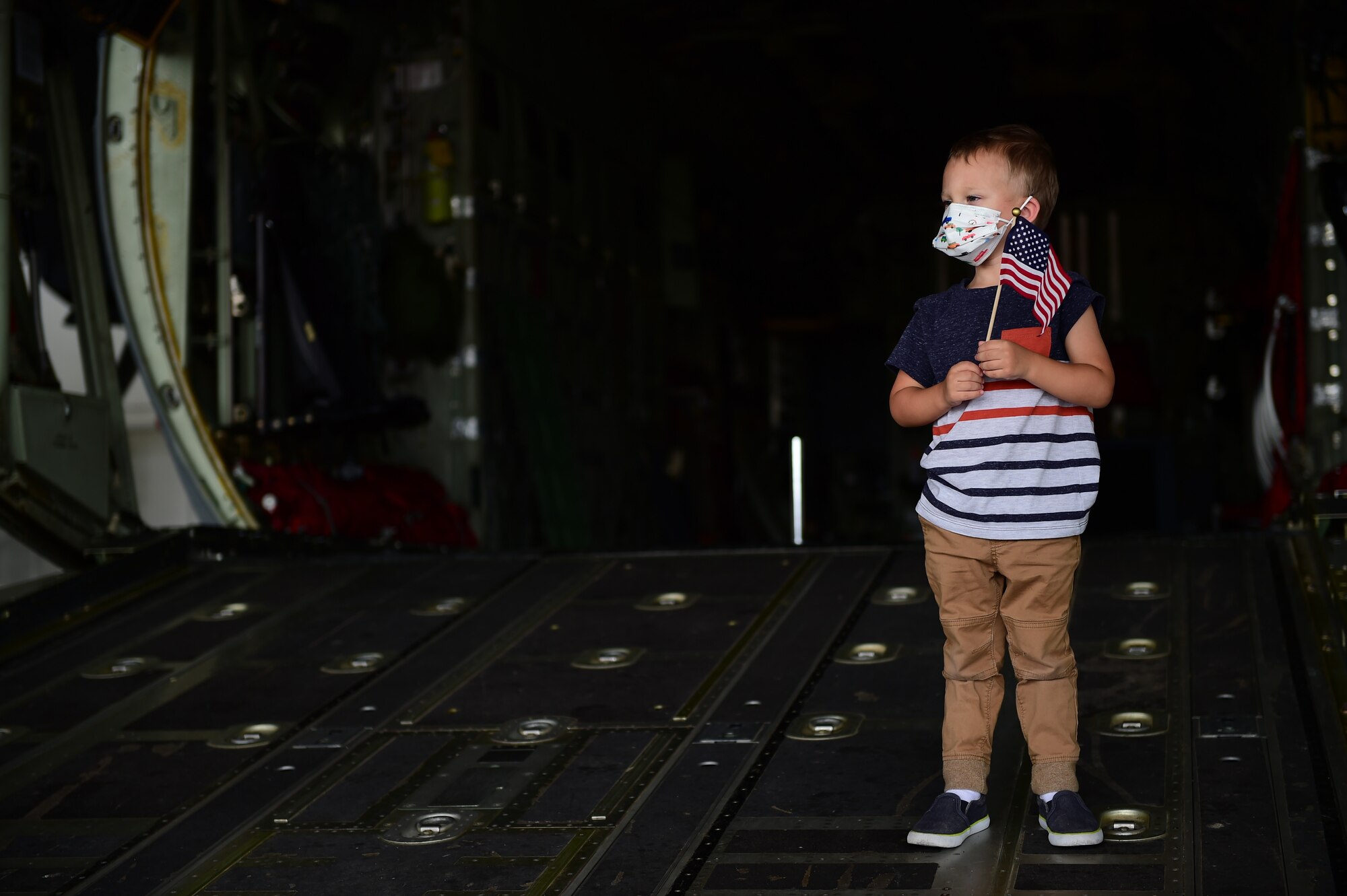 Photo of child on the ramp of an aircraft