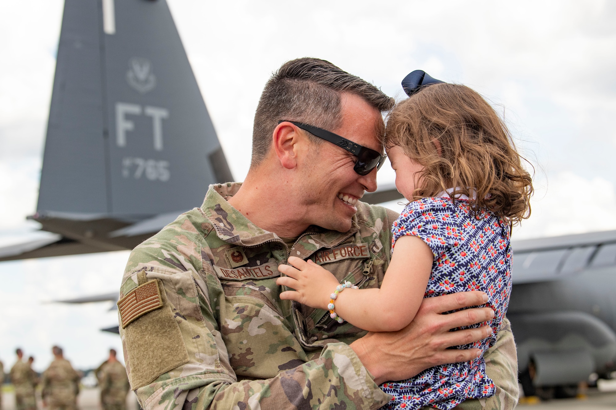 Photo of an Airman and his child
