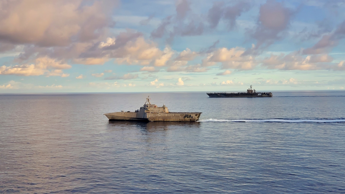 Nimitz-class aircraft carrier USS Carl Vinson (CVN 70) transits the South China Sea with Independence-variant littoral combat ship USS Tulsa (LCS 16), Sept. 7, 2021. Carl Vinson Carrier Strike Group is on a scheduled deployment in the U.S. 7th Fleet area of operations to enhance interoperability with allies and partners while serving as a ready-response force in support of a free and open Indo-Pacific region.