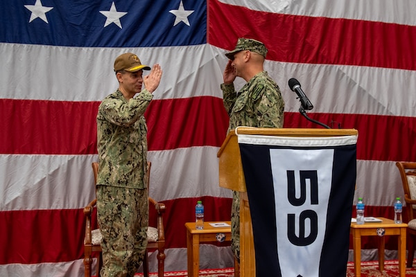 Vice Adm. Brad Cooper, left, commander of U.S. Naval Forces Central Command, U.S. 5th Fleet and Combined Maritime Forces, salutes Capt. Michael D. Brasseur, the first commodore of Task Force (TF 59) during a commissioning ceremony for TF 59 onboard Naval Support Activity Bahrain, Sept. 9. TF 59 is the first U.S. Navy task force of its kind, designed to rapidly integrate unmanned systems and artificial intelligence with maritime operations in the U.S. 5th Fleet area of operations.