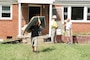 Robert Burick, emergency management specialist with the Louisville District and member of the U.S. Army Corps of Engineers debris response team, talks with volunteers removing debris Sept. 3, 2021 from a flood home in Waverly, Tennessee. Burick is providing technical assistance following deadly flooding in Tennessee when up to 17 inches of rain fell in the region Aug. 21. (USACE Photo by Lee Roberts)