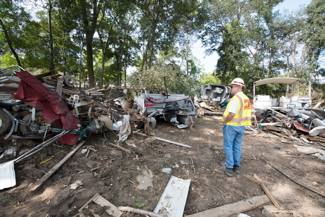 Robert Powers, lead debris subject matter expert and construction representative with the Baltimore District, observes a debris field Sept. 3, 2021 near Trace Creek in Waverly, Tennessee.  Powers is leading a Corps of Engineers' debris technical assistance team in Tennessee following deadly flooding when up to 17 inches of rain fell in the region Aug. 21. (USACE Photo by Lee Roberts)