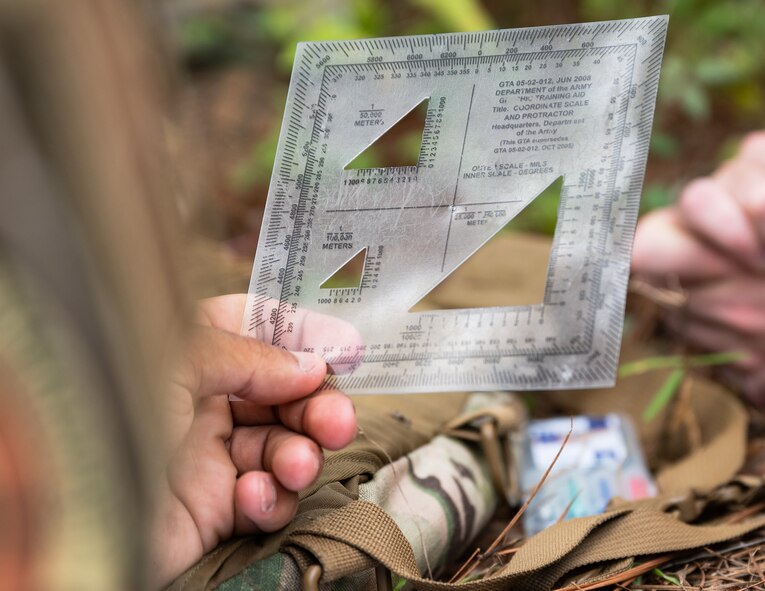 An Airman from the 2nd Security Forces Squadron makes use of a military protractor at Barksdale Air Force Base, Louisiana, Aug. 30, 2021.