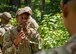 Senior Airman Curtis Logan, 2nd Security Forces Squadron investigator, converses with another Airman at Barksdale Air Force Base, Louisiana, Aug. 30, 2021.