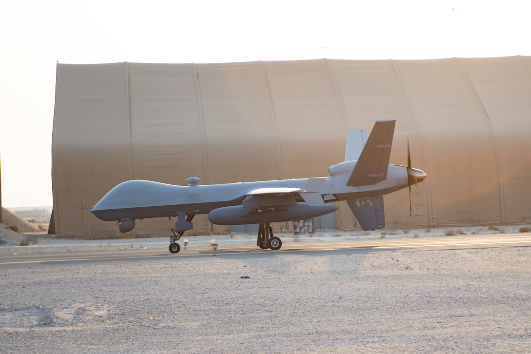 An MQ-9 Reaper taxis at Ali Al Salem Air Base, Kuwait, Aug. 20, 2021. The MQ-9 reaper is capable of carrying munitions, following high value targets for days at a time, has an extended loiter time and can be piloted mostly by itself. (U.S. Air Force Illustration by Senior Airman Helena Owens)