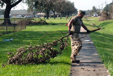 Members of the 149th Fighter Wing help clean up Thibodaux High School in Thibodaux, Louisiana, during Hurricane Ida response Sept. 4, 2021.