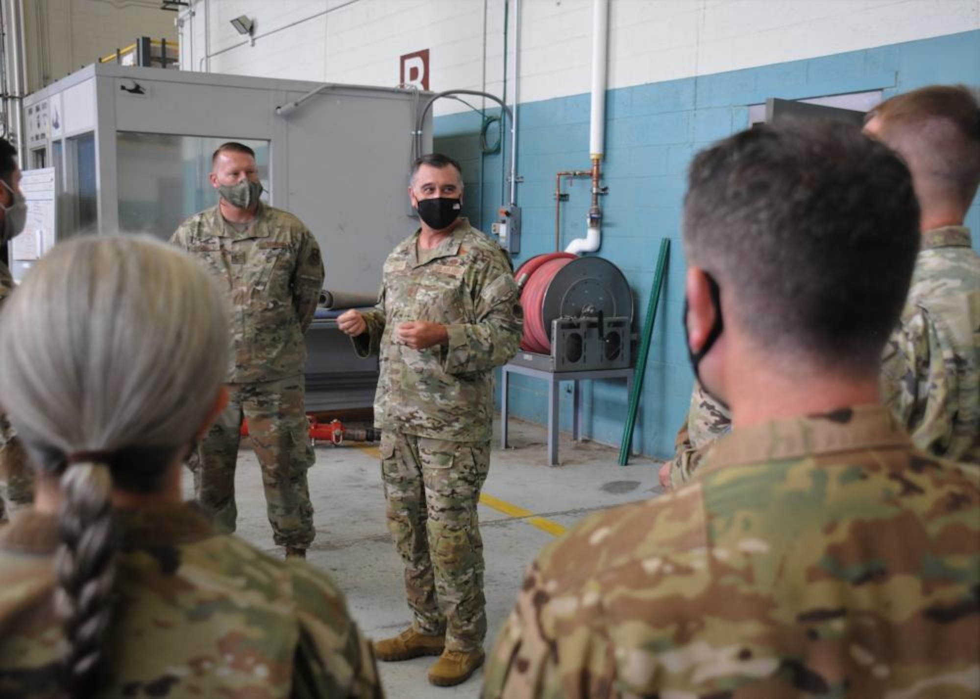 Air Force officer speaks to Airmen.