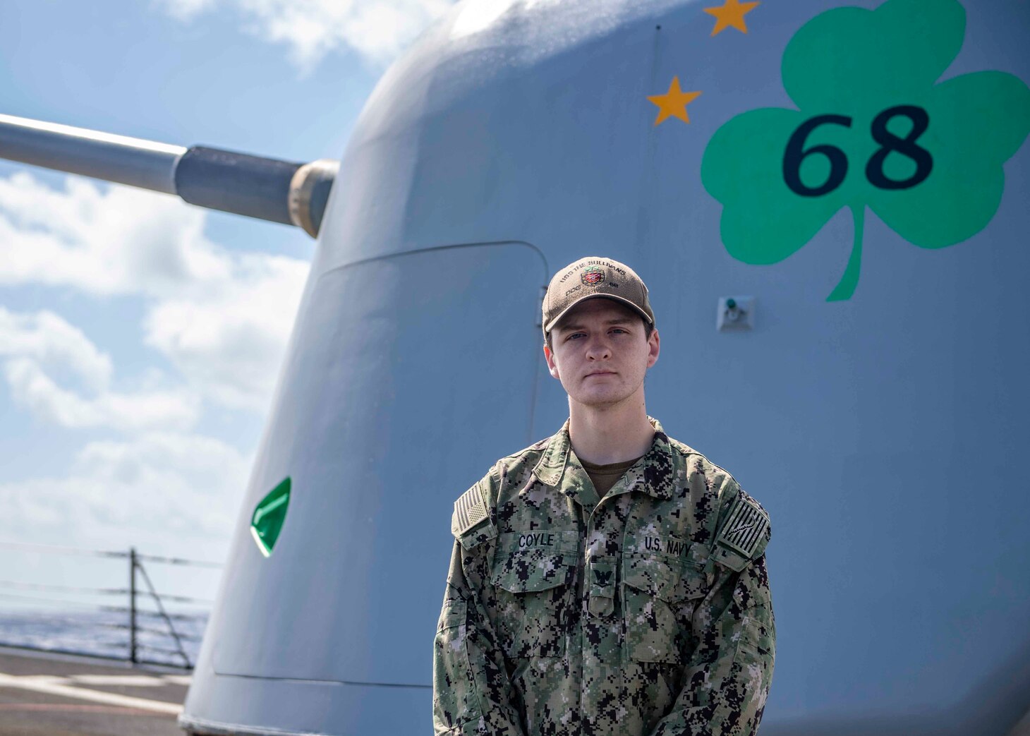Information Systems Technician 3rd Class Matthew Coyle, poses for a portrait on the foc'sle of the guided-missile destroyer USS The Sullivans (DDG 68). (U.S. Navy photo by Ens. Kelly Harris)
