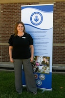 Judy Mott, 97th Force Support Squadron school liaison program manager, poses for a photo on Altus Air Force Base, Oklahoma, Aug. 30, 2021. Mott’s primary responsibility is helping incoming and outgoing students from kindergarten through 12th grade to ensure they have a balanced educational environment. (U.S. Air Force photo by Airman 1st Class Trenton Jancze)