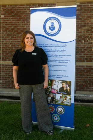 Judy Mott, 97th Force Support Squadron school liaison program manager, poses for a photo on Altus Air Force Base, Oklahoma, Aug. 30, 2021. Mott’s primary responsibility is helping incoming and outgoing students from kindergarten through 12th grade to ensure they have a balanced educational environment. (U.S. Air Force photo by Airman 1st Class Trenton Jancze)
