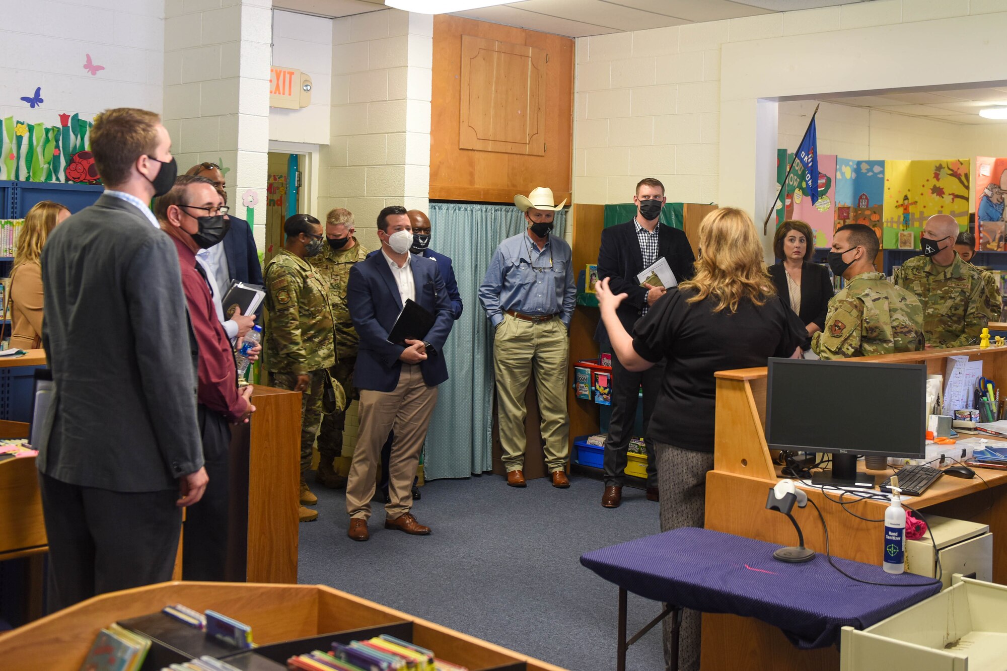 Judy Mott, 97th Force Support Squadron school liaison, speaks to base leaders and visiting legislators on Altus Air Force Base, Oklahoma, Aug. 30, 2021. As a part of her position, Mott works closely with base and civilian leaders. (U.S. Air Force photo by 2nd Lt. Cameron Silver)