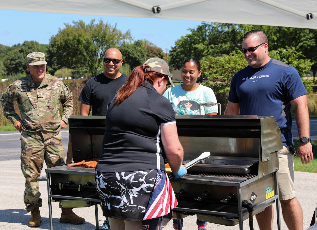 The days event's theme, "Diversity of Hearts and Minds, featured a guest speaker, live music, the 5K run, service booths from across the organization, and a USO-sponsored lunch.