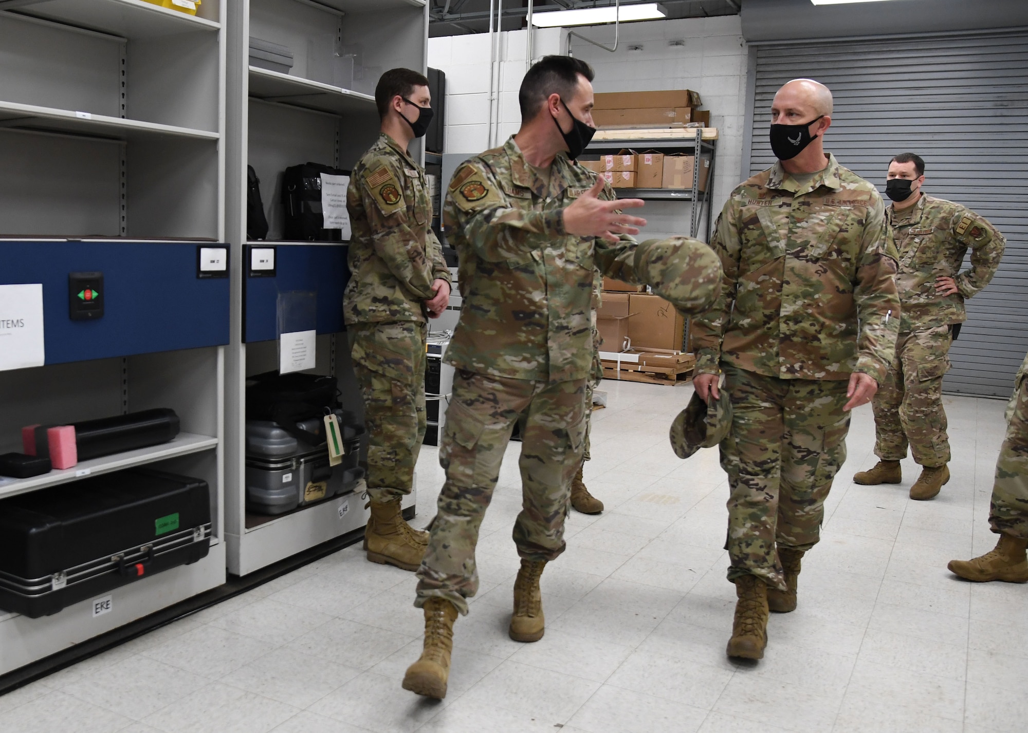 U.S. Air Force Tech. Sgt. Bryan Williams, 85th Engineering Installation Squadron material management assistant NCO in charge, explains the equipment used for installation projects to Col. William Hunter, 81st Training Wing commander, during an 85th EIS immersion tour at Keesler Air Force Base, Mississippi, Sept. 1, 2021. The purpose of the tour was to become more familiar with the squadron's mission and its capabilities. (U.S. Air Force photo by Kemberly Groue)