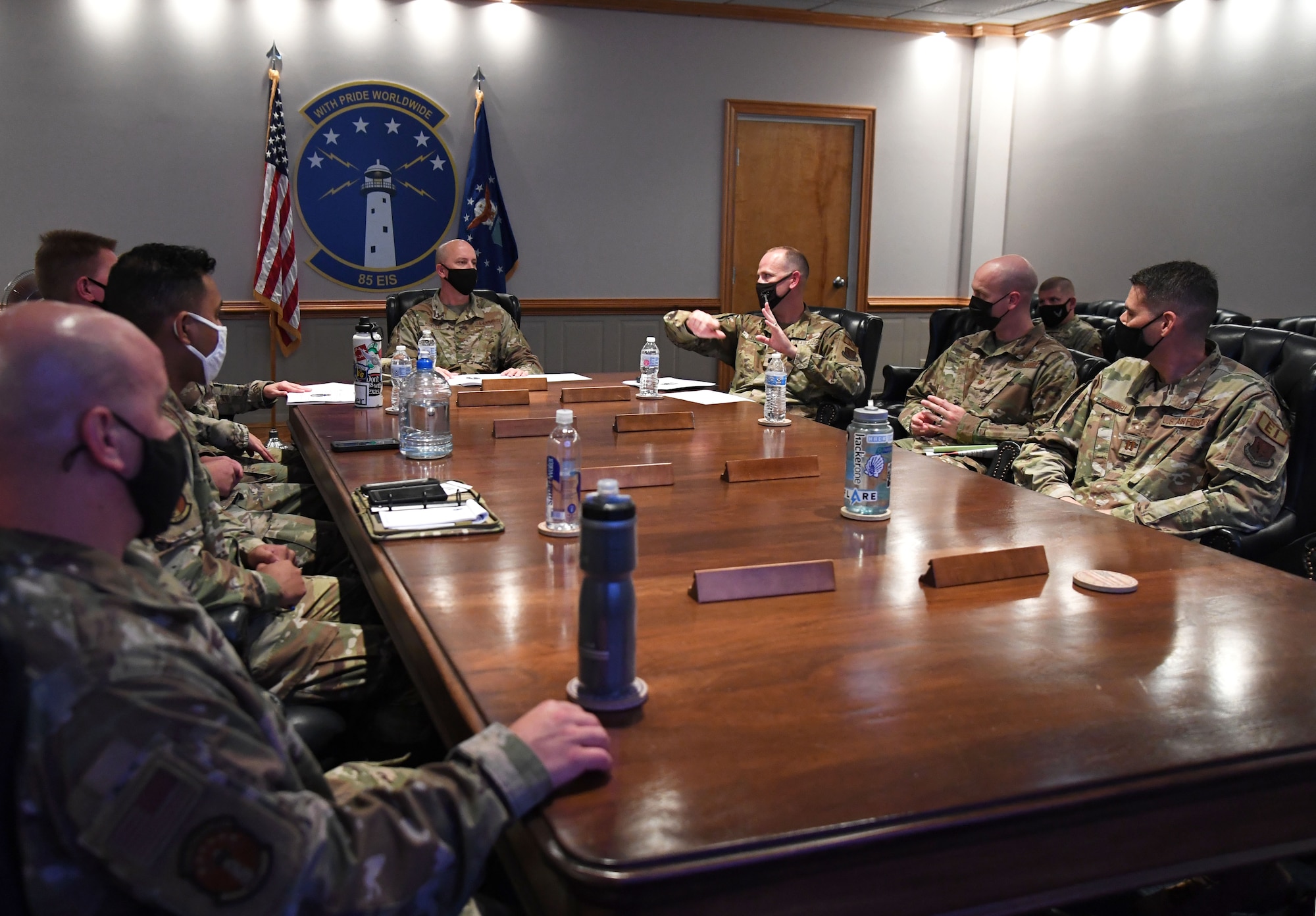 U.S. Air Force Lt. Col. Whit Walker, 85th Engineering Installation Squadron commander, provides Col. William Hunter, 81st Training Wing commander, with a mission brief during an 85th EIS immersion tour at Keesler Air Force Base, Mississippi, Sept. 1, 2021. The purpose of the tour was to become more familiar with the squadron's mission and its capabilities. (U.S. Air Force photo by Kemberly Groue)