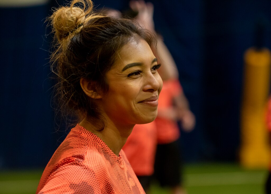 A service member smiling during the Denver Broncos Training camp.