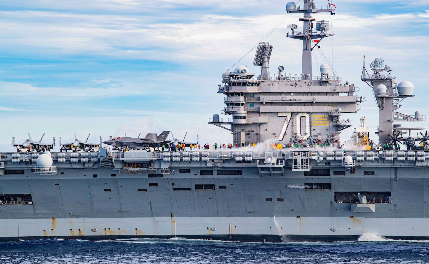 SOUTH CHINA SEA (Sept. 7, 2021) Flight deck personnel aboard Nimitz-class aircraft carrier USS Carl Vinson’s (CVN 70) prepare for flight operations while transiting the South China Sea, Sept. 7, 2021. Carl Vinson Carrier Strike Group is on a scheduled deployment in the U.S. 7th Fleet area of operations to enhance interoperability with allies and partners while serving as a ready-response force in support of a free and open Indo-Pacific region. (U.S. Navy photo by Mass Communication Specialist 3rd Class Richard Cho)