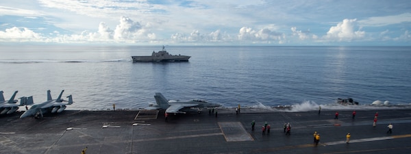 The Nimitz-class aircraft carrier USS Carl Vinson (CVN 70) transits the South China Sea with the Independence-variant littoral combat ship USS Tulsa (LCS 16), Sept. 7, 2021.