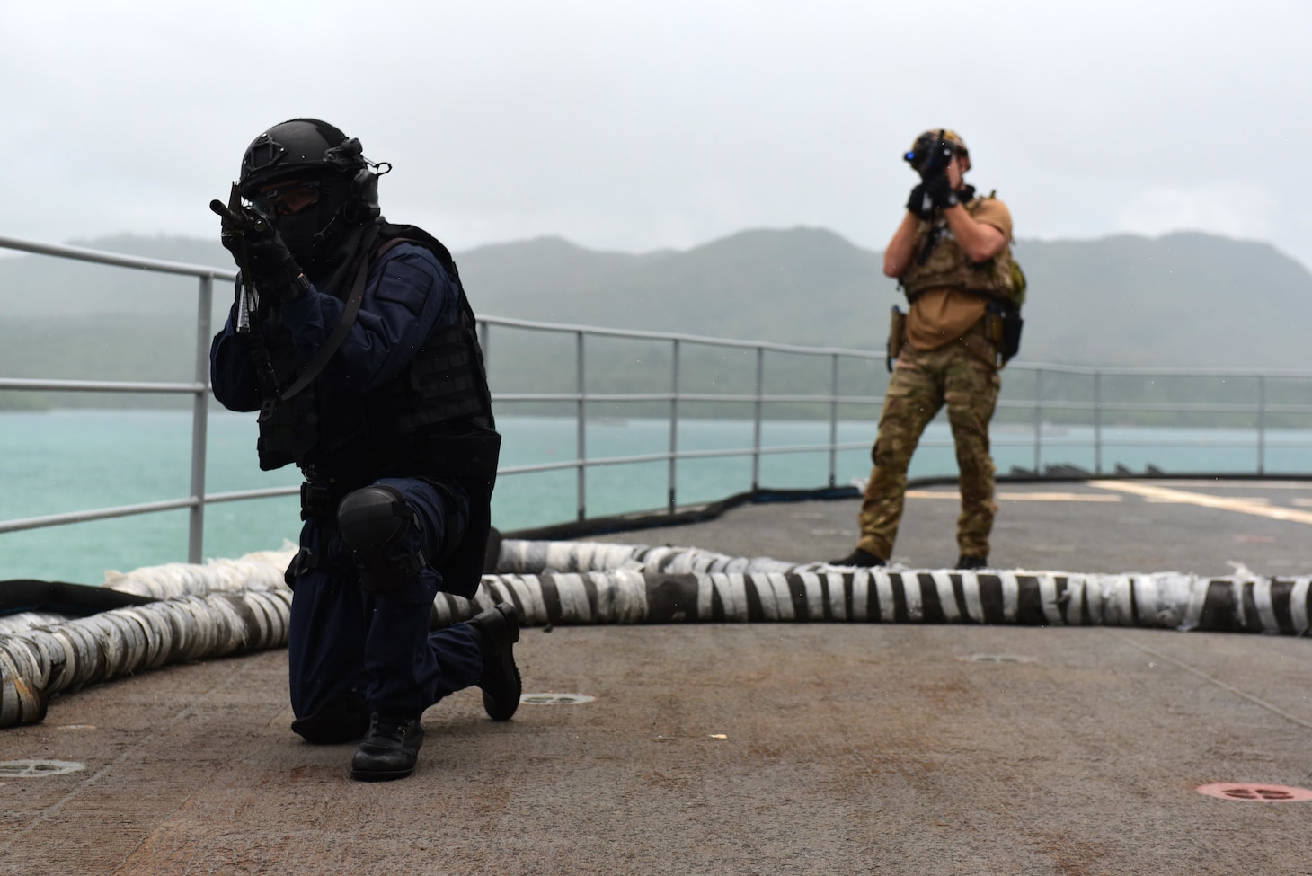 A Japan Maritime Self-Defense Force sailor and a U.S. Naval Special Warfare operator conduct a simulated visit, board, search, and seizure aboard USS Frank Cable (AS-40) as part of MALABAR 2021. MALABAR 2021 is an example of the enduring partnership between Australian, Indian, Japanese and American maritime forces, who routinely operate together in the Indo-Pacific, fostering a cooperative approach toward regional security and stability. Naval Special Warfare is the nation’s premiere maritime special operations force and is uniquely positioned to extend the Fleet’s reach and deliver all-domain options for naval and joint force commanders.