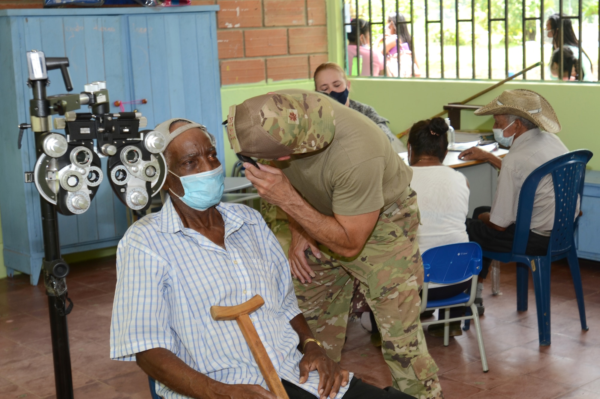 South Carolina Air National Guard Maj. Sean Pitale, a doctor with the 169th Medical Group, examines a Colombian patient Sept. 4, 2021. SCNG medical personnel provided medical care to more than 300 people in the remote town of Tamana, Colombia, as part of exercises with its State Partnership Program partner Colombia Aug. 30 to Sept. 10, 2021.
