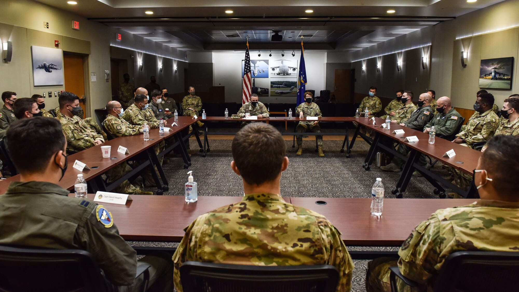 U.S. Air Force Gen. Jacqueline D. Van Ovost, Air Mobility Command commander, and Chief Master Sgt. Brian Kruzelnick, AMC command chief, discuss lessons learned with 305th Air Mobility Wing Airmen during a visit to Joint Base McGuire-Dix-Lakehurst, N.J., Sept. 8, 2021. 305th AMW crews were instrumental to the Operation Allies Refuge mission and were among the first to help evacuate. (U.S. Air Force Photo by Staff Sergeant Shay Stuart)