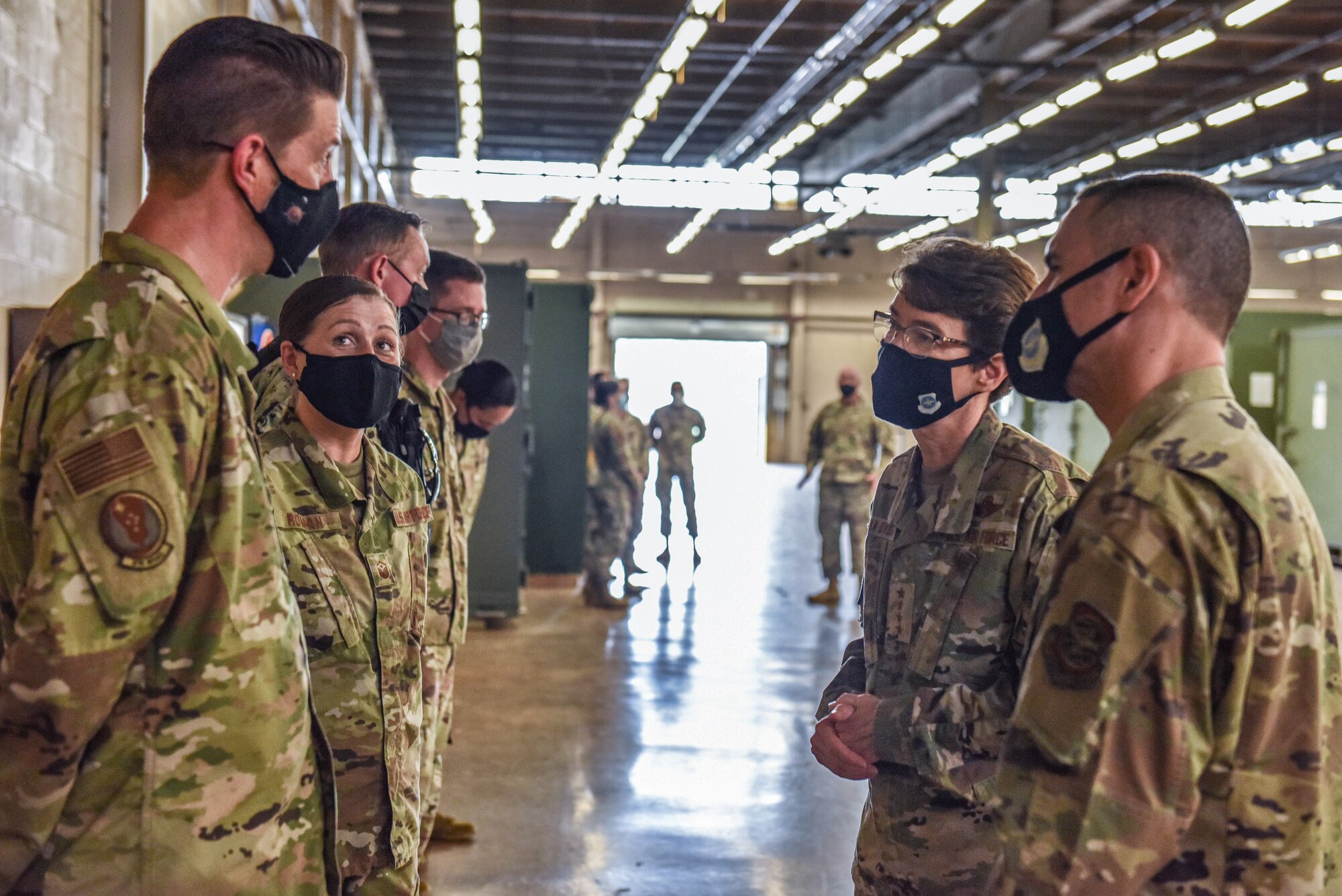 U.S. Air Force Gen. Jacqueline D. Van Ovost, Air Mobility Command commander, and Chief Master Sgt. Brian Kruzelnick, AMC command chief, visit with Airmen from various units across Joint Base McGuire-Dix-Lakehurst, N.J., Sept. 8, 2021. The AMC Team is visiting the 87th Air Base Wing to recognize personnel who were instrumental in setting up Liberty Village on the installation. Liberty Village is managed by Joint Task Force-Liberty and provides housing and care for vulnerable Afghans going through the immigration process with the Department of Home Affairs. (U.S. Air Force Photo by Staff Sergeant Shay Stuart)