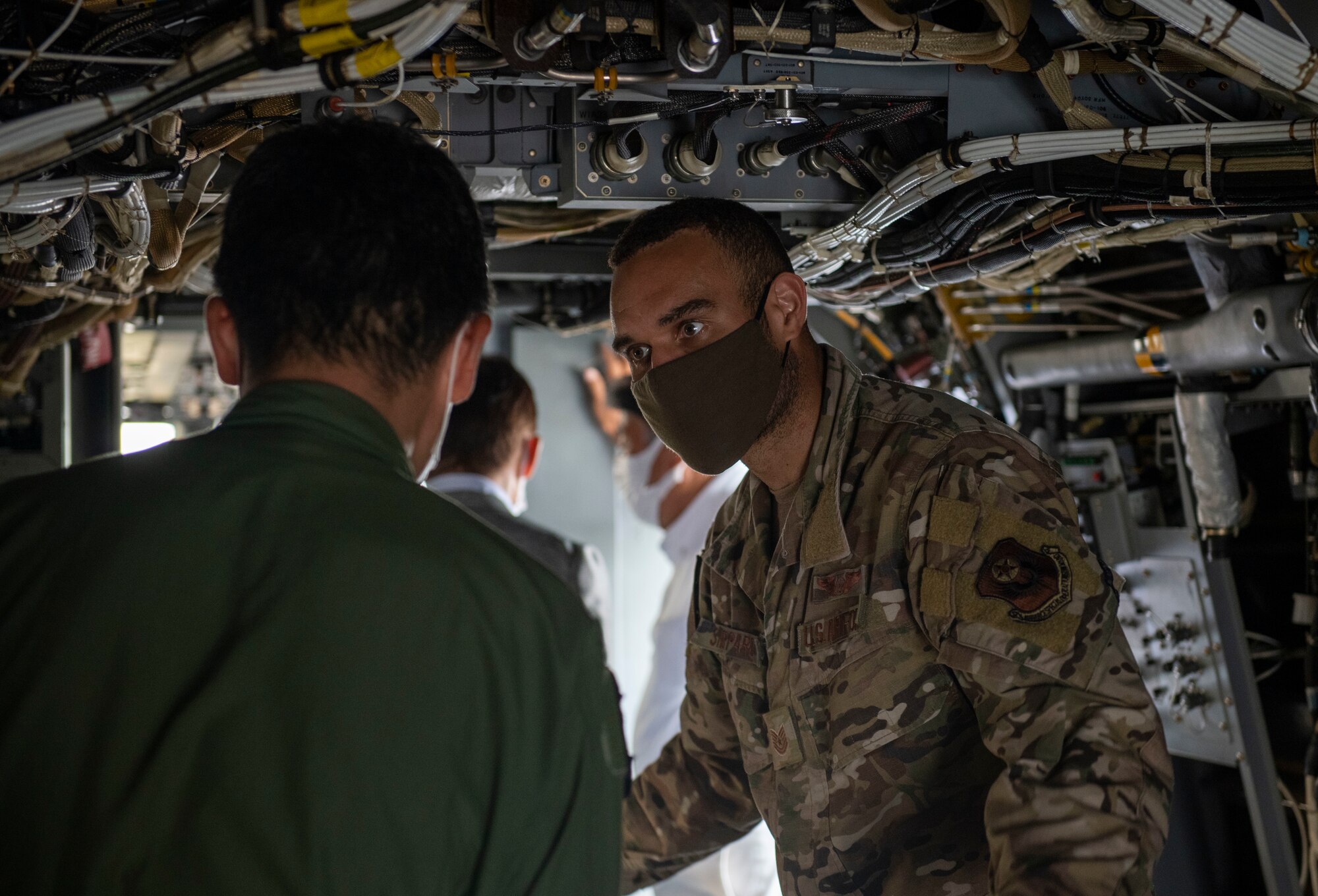 A flight engineer assigned 21st Special Operations Squadron gives a tour of a CV-22 Osprey