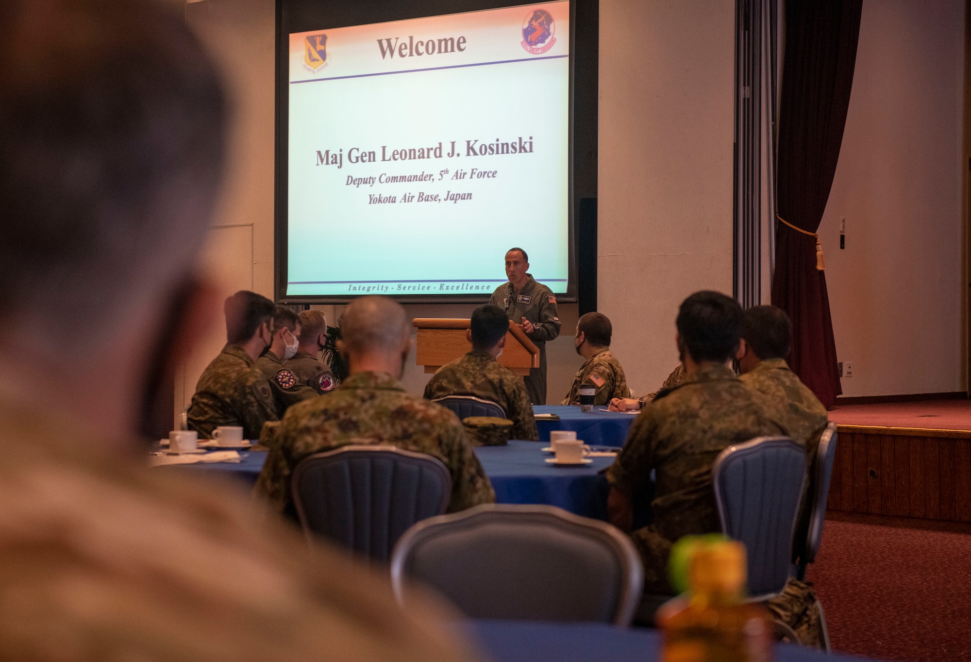 A U.S. Air Force officer welcomes Helicopter Symposium attendees