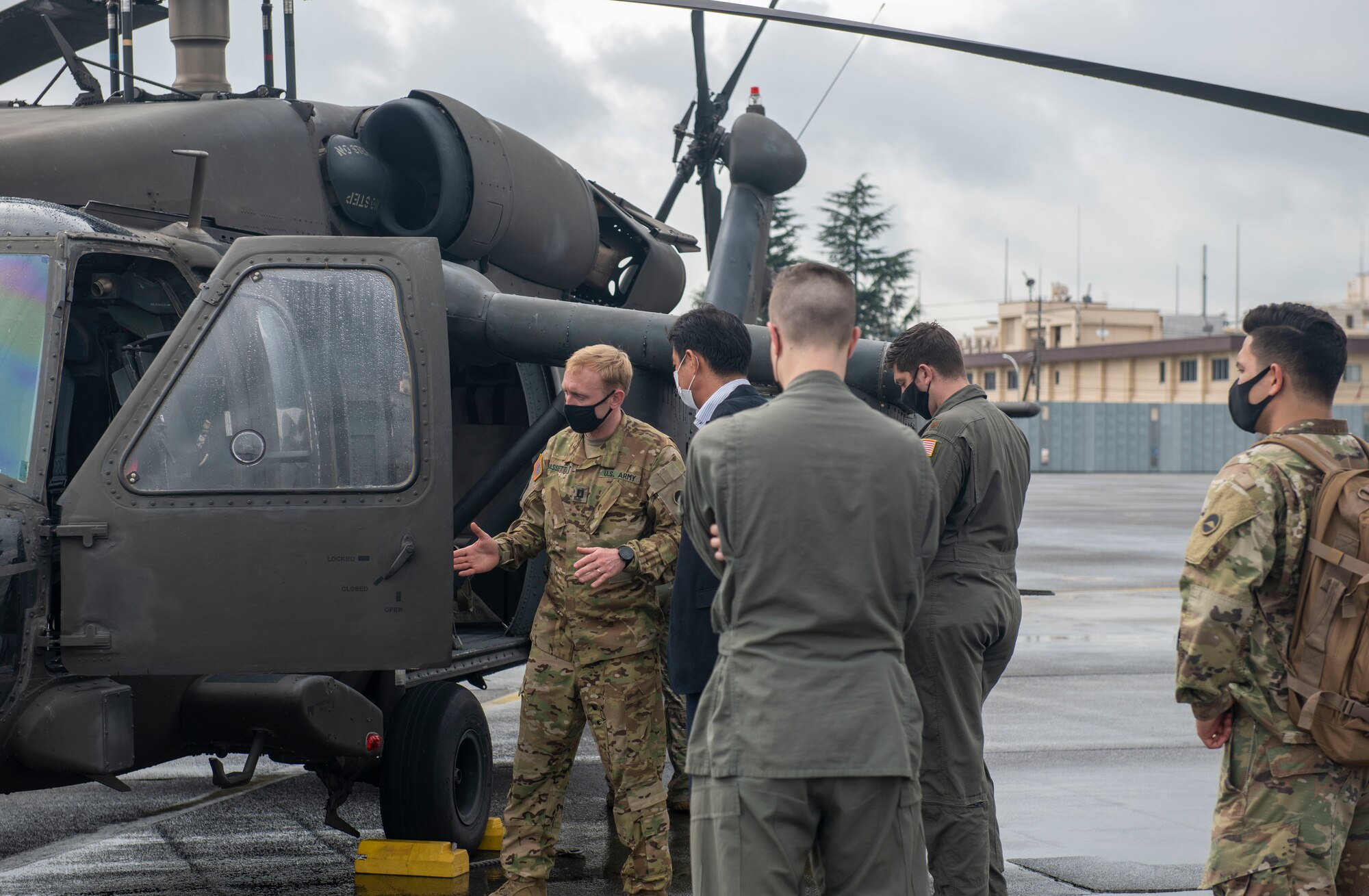 U.S. Army pilot, guides Helicopter Symposium attendees through a tour of a UH-60L Black Hawk