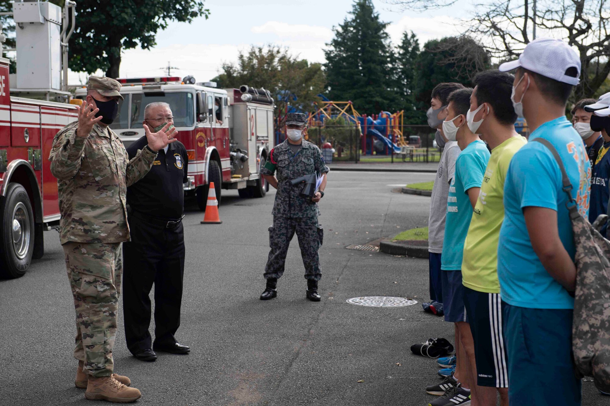 Col. Patrick Launey, 374th Mission Support Group commander, addresses participants of the 10th annual Yokota Fire Emergency 9/11 Tower Run at Yokota Air Base, Japan, Sept. 10, 2021.