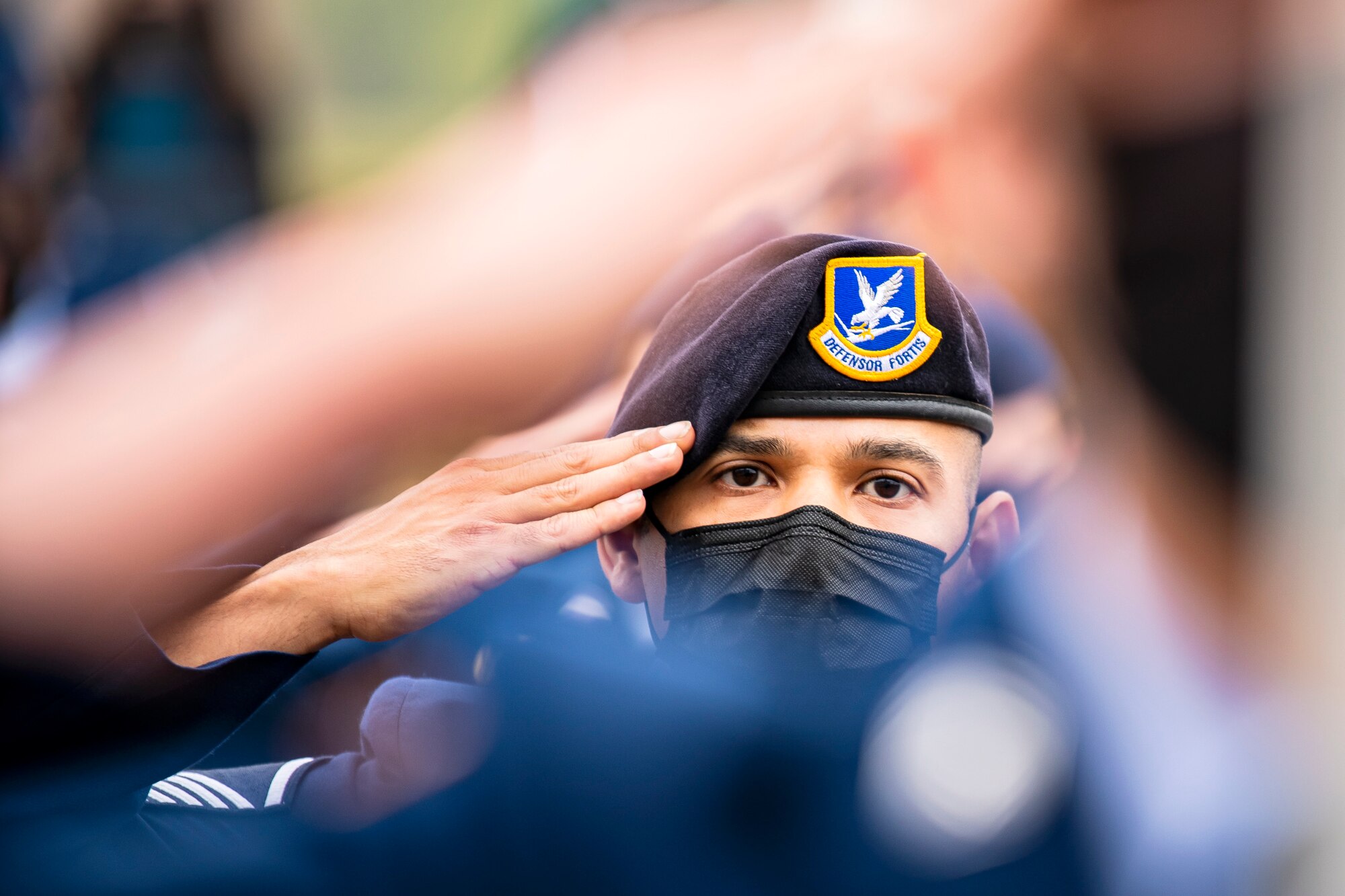 Master Sgt. Christian Navarro-Salazar, 423rd Security Forces Squadron supply and logistics superintendent, salutes during a 9/11 remembrance ceremony at RAF Alconbury, England, Sept. 9, 2021. Airmen from the 501st Combat Support Wing, cadets from the Alconbury Middle Highschool JROTC and guests came together to pay homage to those who lost their lives during the Sept. 11, 2001, attacks. (U.S. Air Force photo by Senior Airman Eugene Oliver)