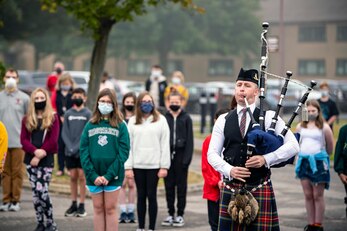 Ian Hildreth, plays the bagpipes during a 9/11 Remembrance ceremony at RAF Alconbury, England,Sept. 9, 2021.  Airmen from the 501st Combat Support Wing, cadets from the Alconbury Middle Highschool JROTC and guests came together to pay homage to those who lost their lives during the Sept. 11, 2001, attacks. (U.S. Air Force photo by Senior Airman Eugene Oliver)