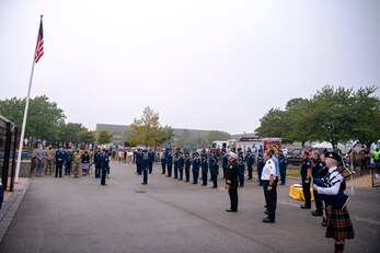 Airmen from the 501st Combat Support Wing, Cadets from the Alconbury Middle High School JROTC along with guests, attend a 9/11 remembrance ceremony at RAF Alconbury, England, Sept. 9, 2021. Airmen, Cadets and guests came together to pay homage to those who lost their lives during the Sept. 11, 2001, attacks. (U.S. Air Force photo by Senior Airman Eugene Oliver)