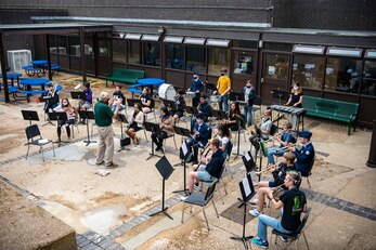 Students from the Alconbury Middle High School band play the national anthem during a 9/11 remembrance ceremony at RAF Alconbury, England, Sept. 9, 2021. Airmen from the 501st Combat Support Wing, cadets from the Alconbury MHS JROTC and guests came together to pay homage to those who lost their lives during the Sept. 11, 2001, attacks. (U.S. Air Force photo by Senior Airman Eugene Oliver)