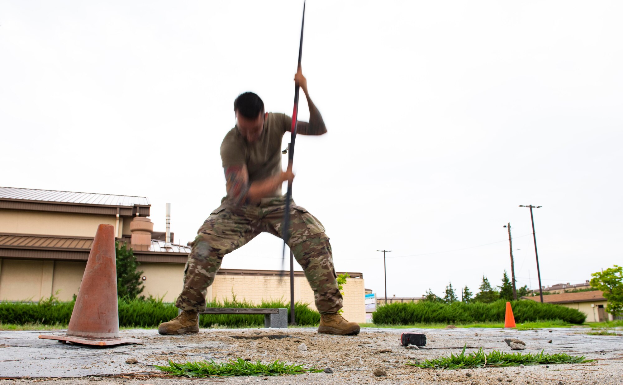 U.S. Air Force Staff Sgt. William Criswell, 8th Civil Engineer Squadron noncommissioned officer in charge of the lock shop, breaks down dirt for the foundation of the Wolf Pack Legacy Garden at Kunsan Air Base, Republic of Korea, Aug 28, 2021. Volunteers from across Kunsan Air Base dedicated hours of woodworking, gardening, painting and more to ensure the pergola and garden were built and dedicated to veterans by Sept 8, 2021.. (U.S. Air Force photo by Staff Sgt. Gabrielle Spalding)